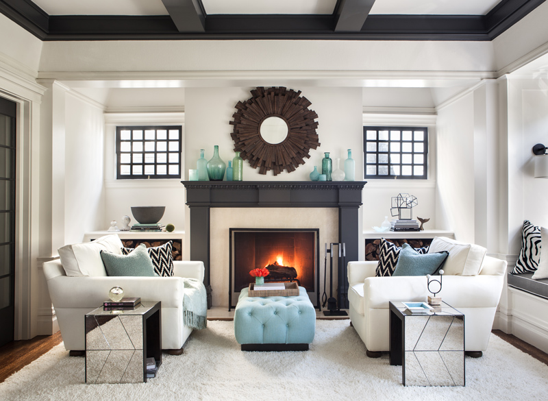 Beautiful interior design in living room with symmetrical white couches and light blue accents