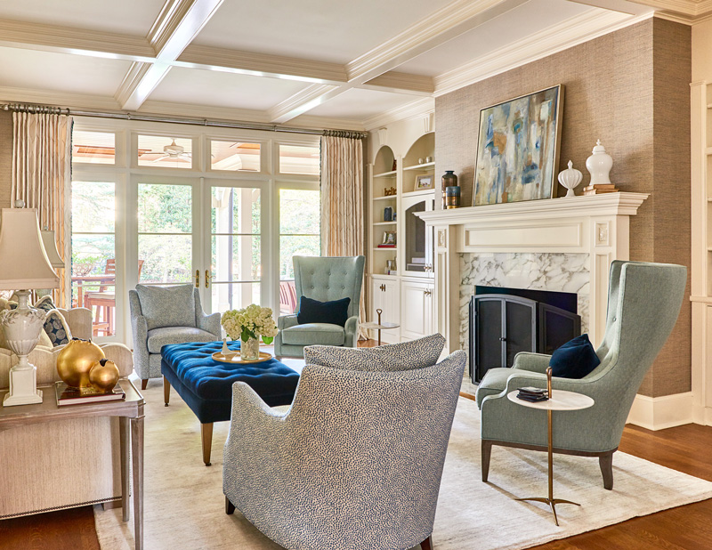 Beautiful interior design in living room with blue armchairs and neutral accents